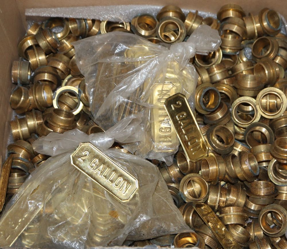 A quantity of brass watering can labels